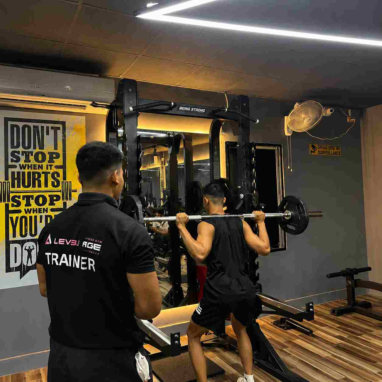 Trainer spotting squat